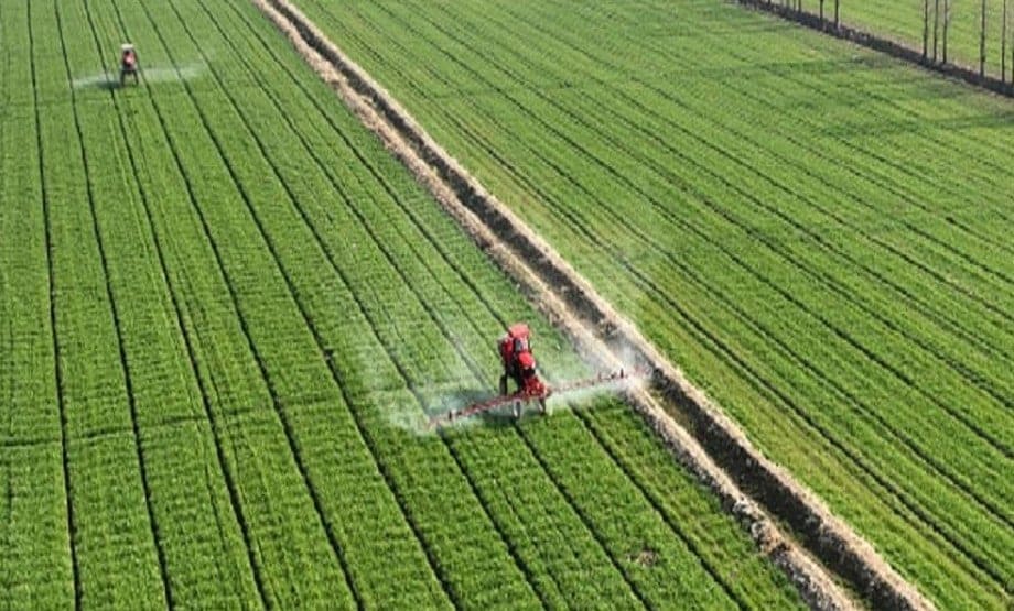 Farmers drive sprinkler irrigation machines in a wheat field in East China’s Jiangsu province. Costfoto/Future Publishing via Getty Images